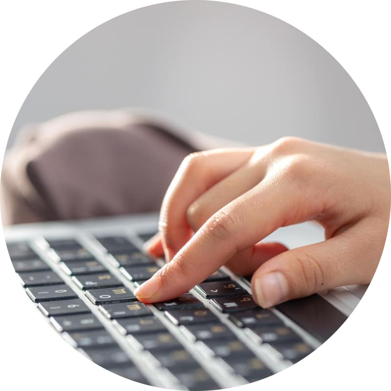 A contributor typing on a keyboard